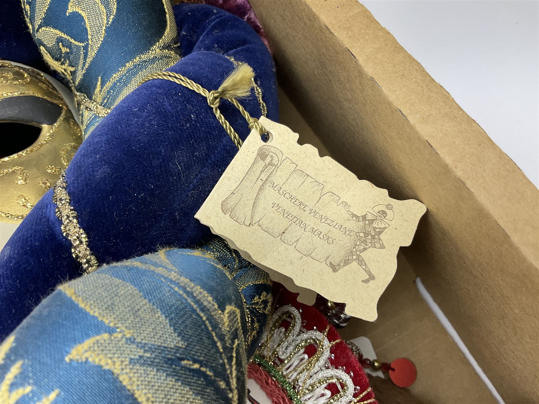 Large collection of decorative Venetian masks, to include two bearing tags for La Maschera Del Galeone, in two boxes 