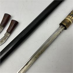 Early 20th century Indian sword stick, the 61.5cm steel blade with punched decoration to one side; horn handle with brass lion mask pommel and ferrule; ebonised shaft with carved bands L92cm overall; and a kukri with curving blade, hardwood and brass grip in leather covered scabbard with two skinning knives (2)