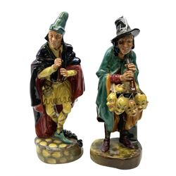 Two Royal Doulton figures, comprising 'The Pied Piper' HN2102 and 'The Mask Seller' HN2103