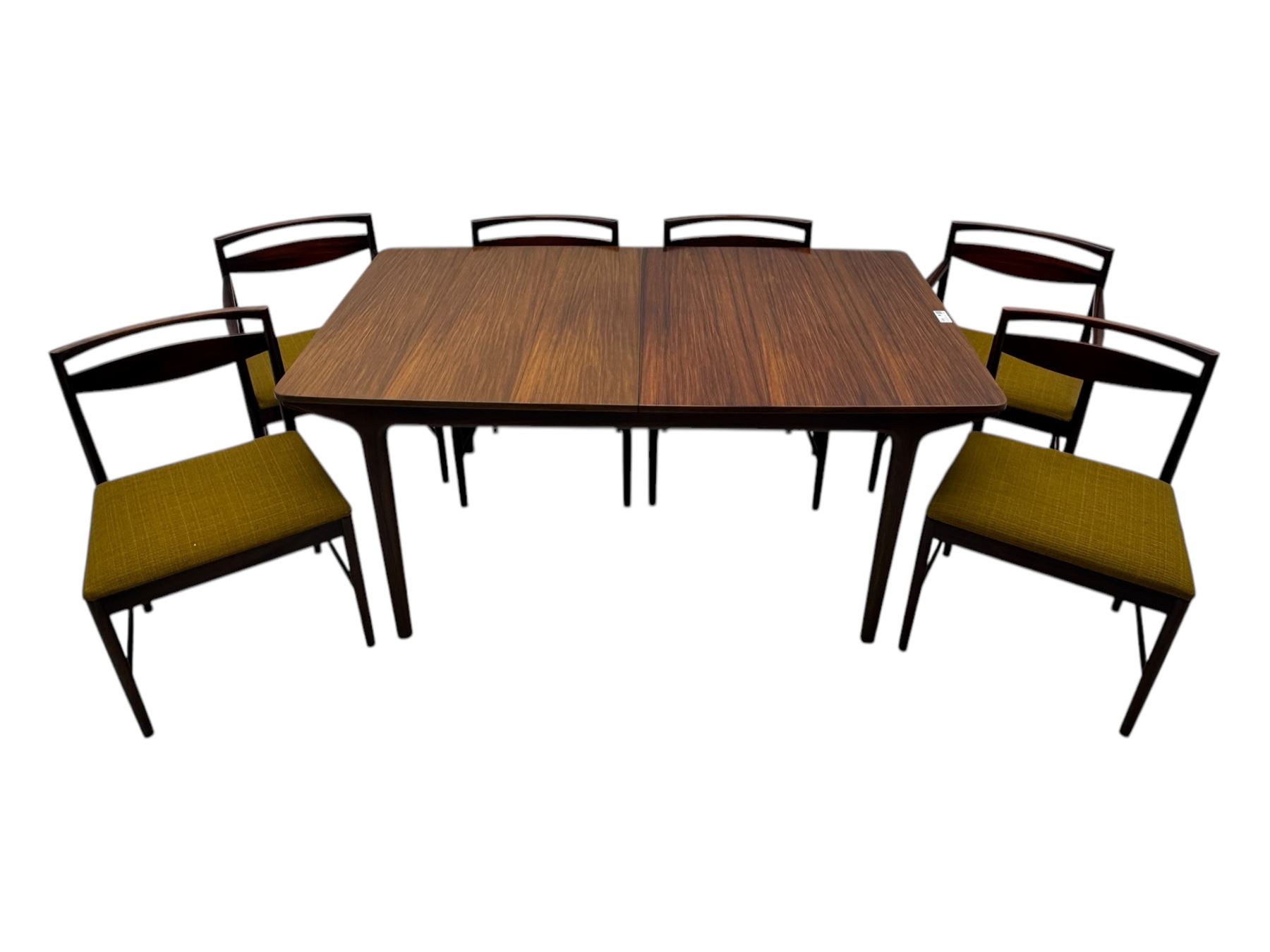 Tom Robertson for McIntosh of Kirkcaldy - mid-20th century 'Dunfermline' dining table, rectangular top with double concealed integral leaf, raised on tapered supports; complete with set of six (4+2) McIntosh dining chairs