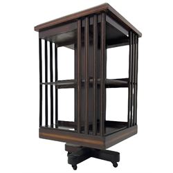 20th century mahogany revolving bookcase, inlaid centre motif, satinwood banded border