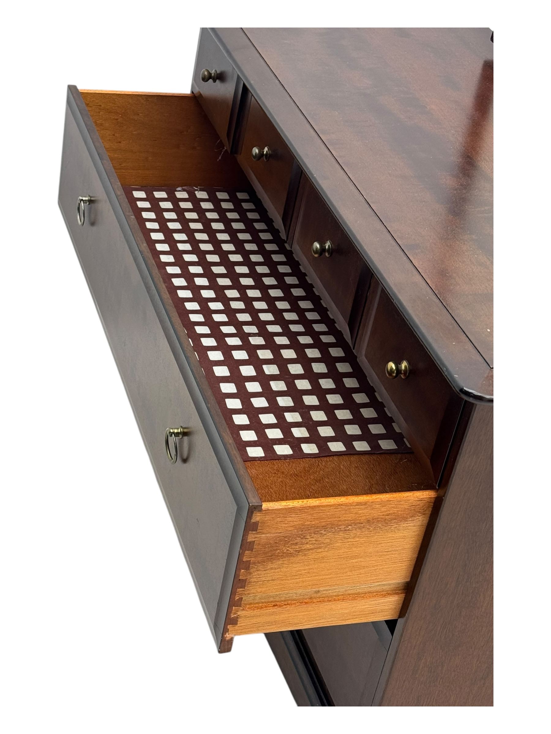 Stag Minstrel - mid-20th century mahogany dressing chest, rectangular top surmounted by adjustable mirror, the upper section fitted with four small drawers over two full-width drawers, on bracket feet
