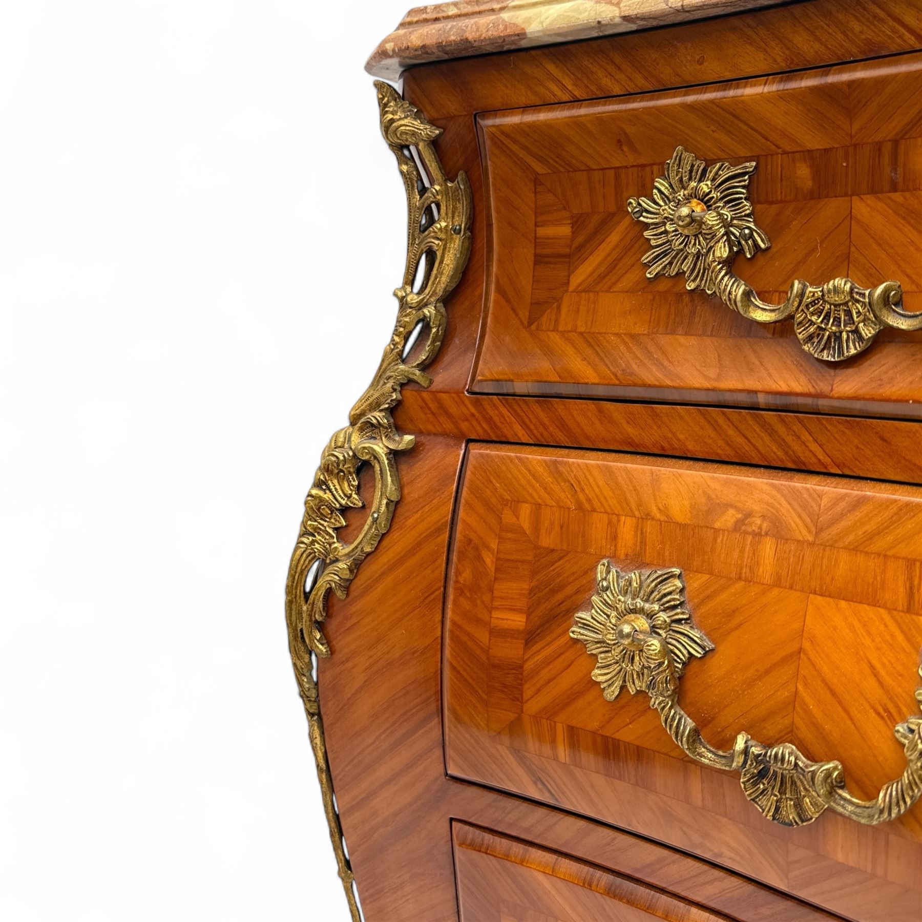 20th century Louis XV design serpentine commode, the rectangular breccia marble top with a rounded moulded edge and projecting corners, above a bombe bombe-shaped kingwood and parquetry design front of two short and two graduated drawers with rococo style handles, corners with gilt-bronze foliate mounts on short cabriole form feet with gilt bronze sabots  