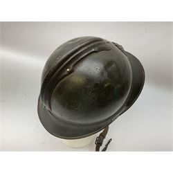 WW2 French M-26 Adrian Pattern Steel Helmet, original olive drab paint finish; flaming grenade badge to the front signifying issue to an Infantry regiment; original leather liner and leather chinstrap; and WW2 Dutch steel helmet with liner and chin strap (2)