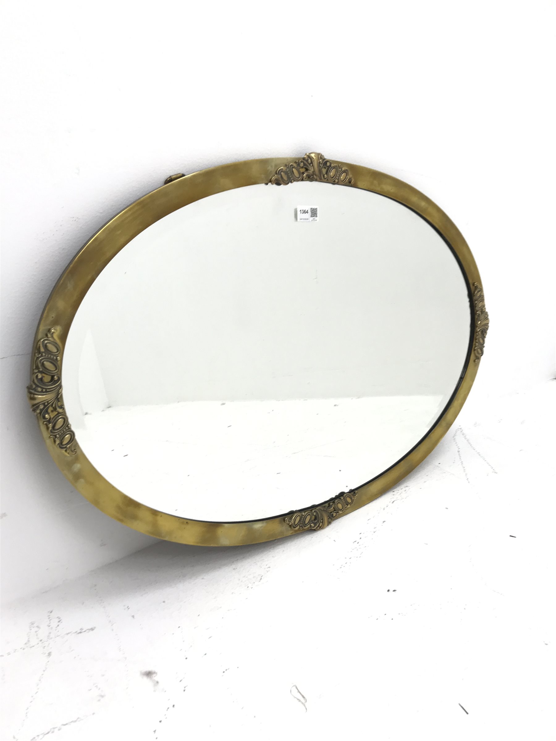 Early 20th century classical oval brass framed bevel edge mirror, W82cm