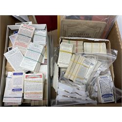 Quantity of cigarette and trade cards, housed in albums and loose, by W.D. & H.O. Wills, John Player & Sons etc, including cycling, garden hints, Britain's railways, dogs etc and various empty vintage cigarette card albums, in two boxes
