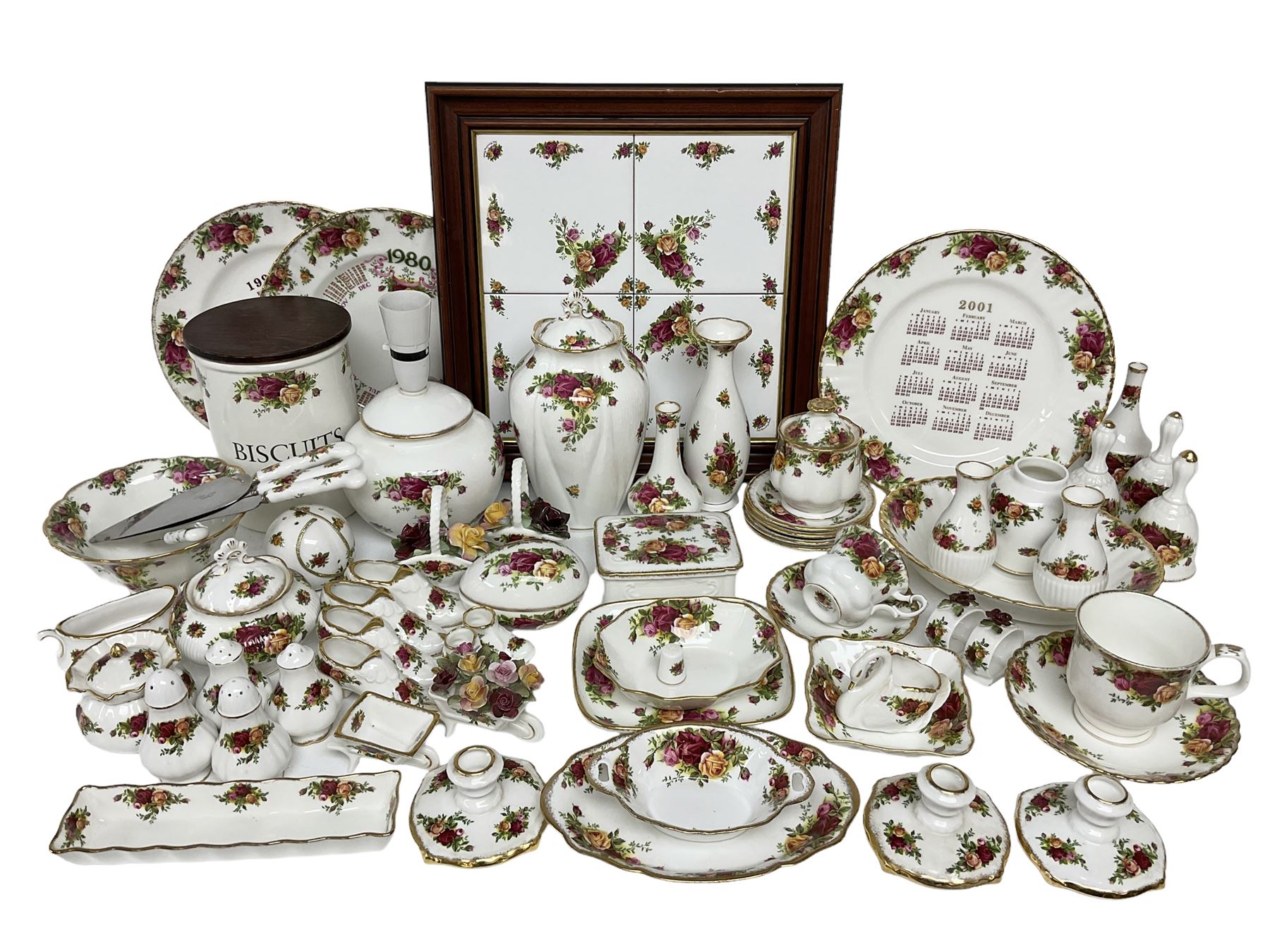 Royal Albert Old Country Roses pattern ceramics, to include table lamp, lidded vase, two pairs of salt and pepper shakers, cups and saucers, plates, biscuit jar, bowls, lidded preserve pot, vases, dishes, knives, napkin rings, lidded jars and box, pair of candlesticks etc