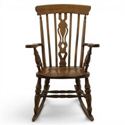 Farmhouse elm rocking chair, high back with 'Fleur De Lis' splat, shaped arms above turned supports, on rocker base 