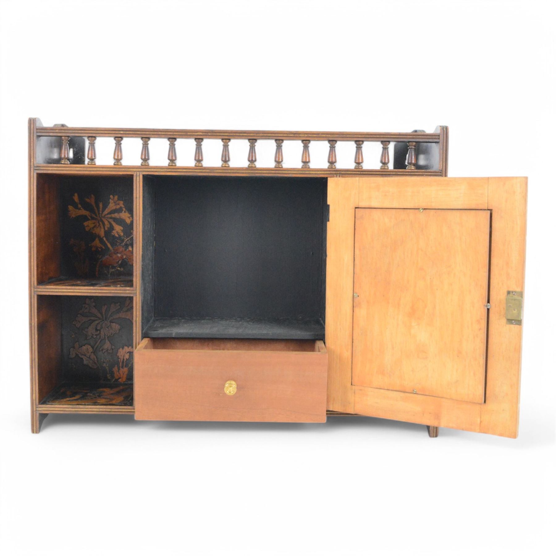 Japanese wall cabinet, the central hinged panel depicting a warrior opening to reveal single drawer, with two shelves to either side decorated throughout with floral and foliate decoration, H47cm