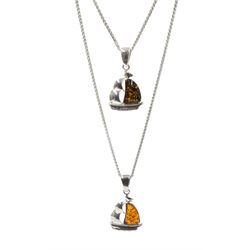 Two silver Baltic amber boat pendant necklaces; one orange and the other green coloured amber, stamped 925 (2) 