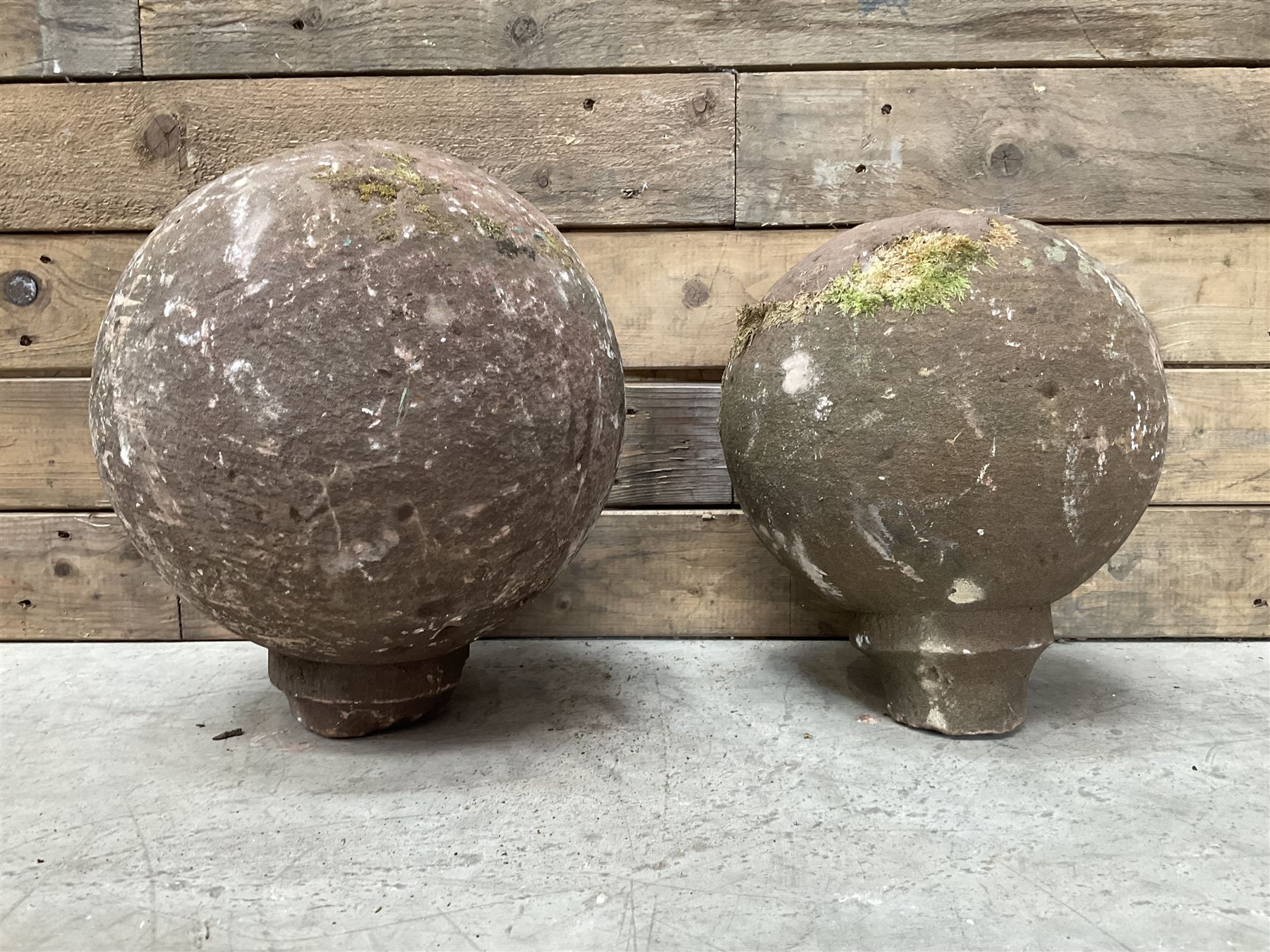 Two spherical stone gate post finials