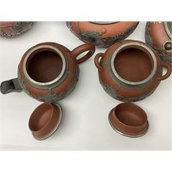 20th century Chinese pewter mounted Yixing tea wares, to include teapots, hot water pots and sugar bowls (10)