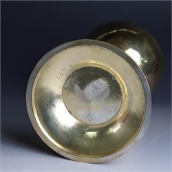 Mid 20th century silver-gilt chalice, the goblet with hammered finish upon knopped stem, the knop embossed with symbols and foliate decoration, engraved to base ' veni non ministrari sed ministrare' and with presentation engraving to underside, hallmarked Guild of Handicraft, London 1957, H17cm