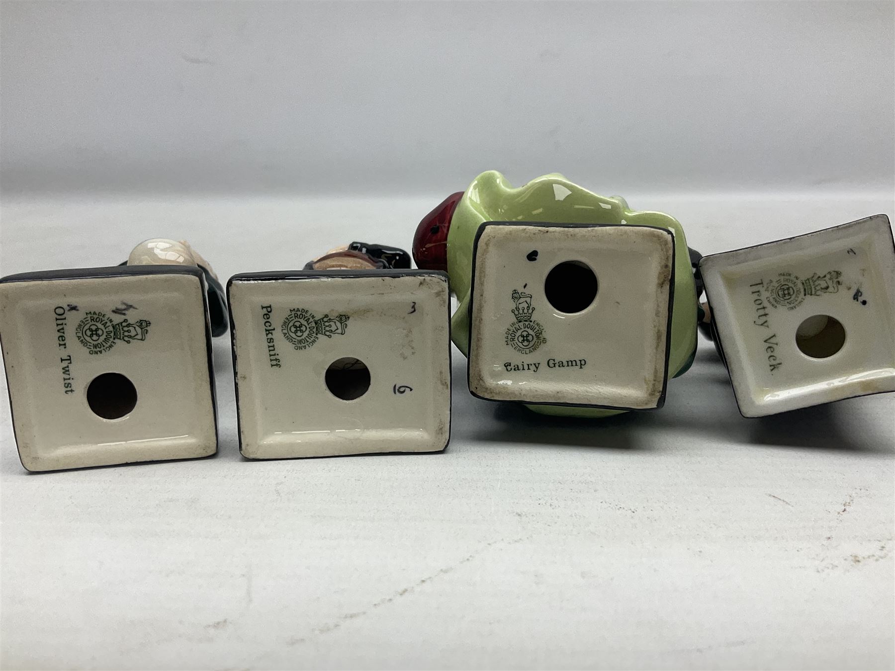 Sixteen Royal Doulton Charles Dickens figures, to include Oliver Twist, Fat Boy, Fagan, Stiggins etc, all with printed marks beneath