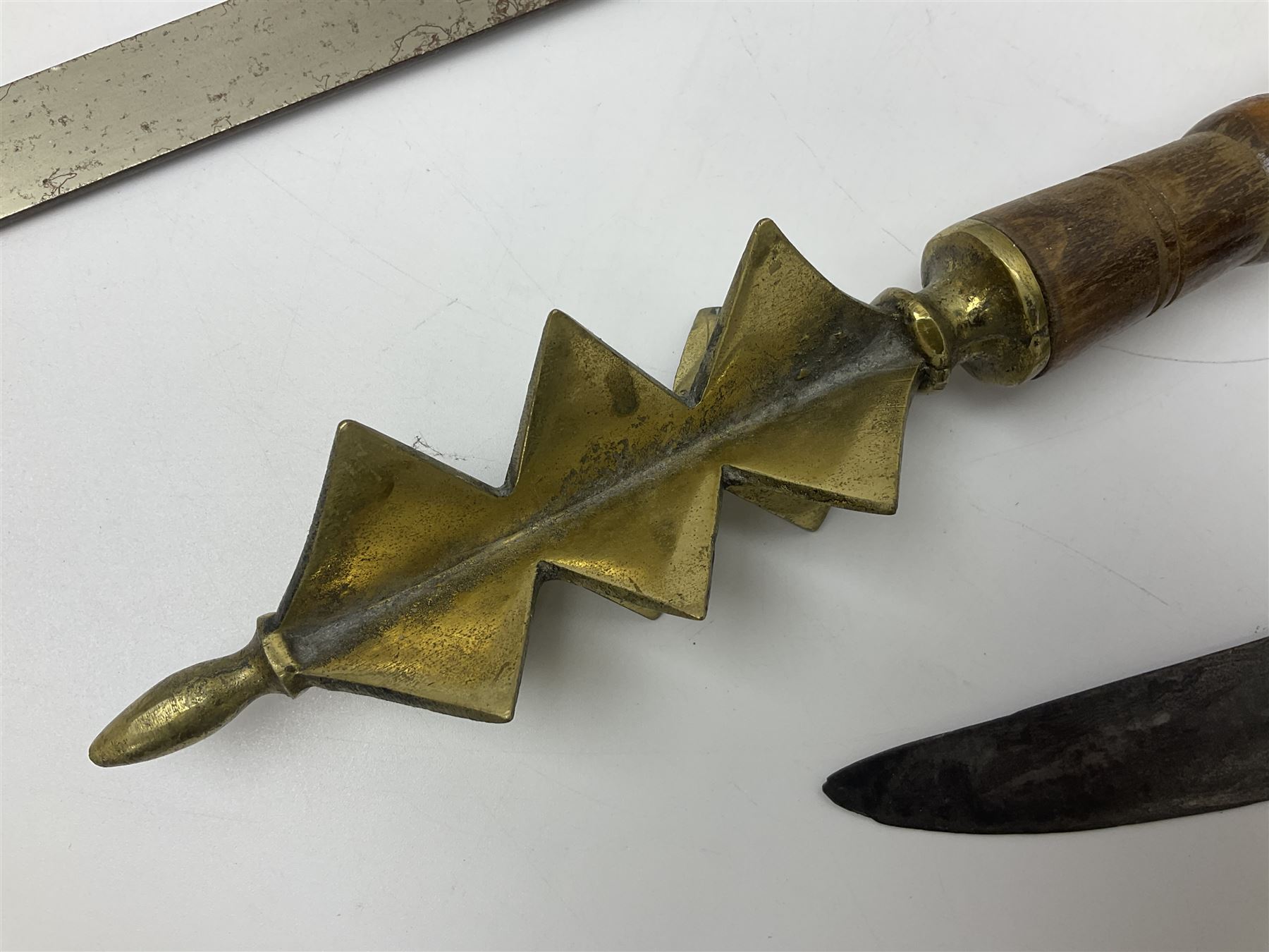 Near pair of short swords each with slightly curving 41cm fullered steel blade and all brass H-shaped hilt L52cm overall; plaited black leather whip; and reproduction pair of brass hilted swords, brass halberd blade and mace (7)