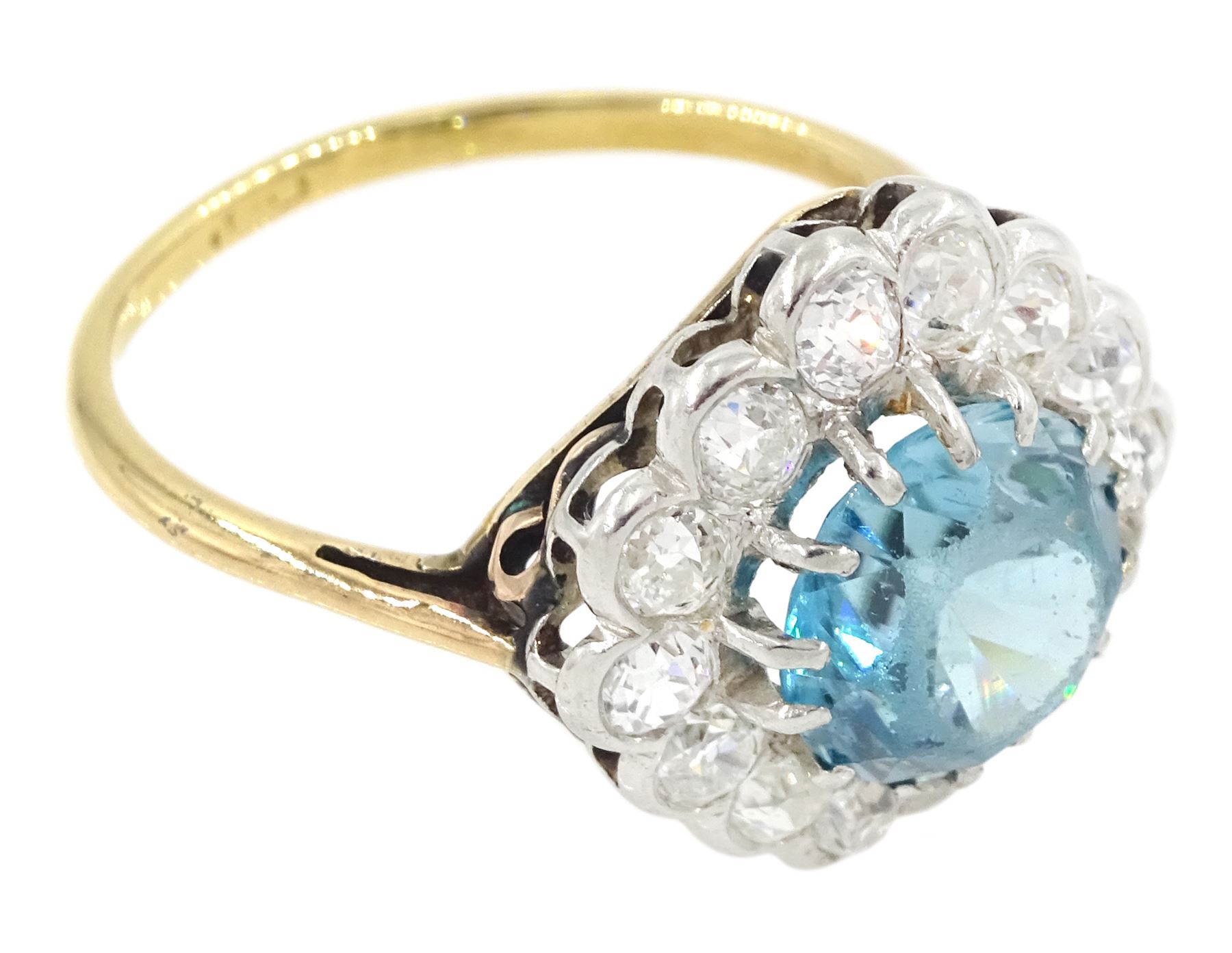 Early 20th century 18ct gold round cut blue zircon and old cut diamond cluster ring, zircon approx 3.35 carat, total diamond weight approx 1.10 carat