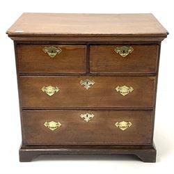 Small Georgian oak chest, fitted with two short and two long drawers, raised on shaped plinth base 