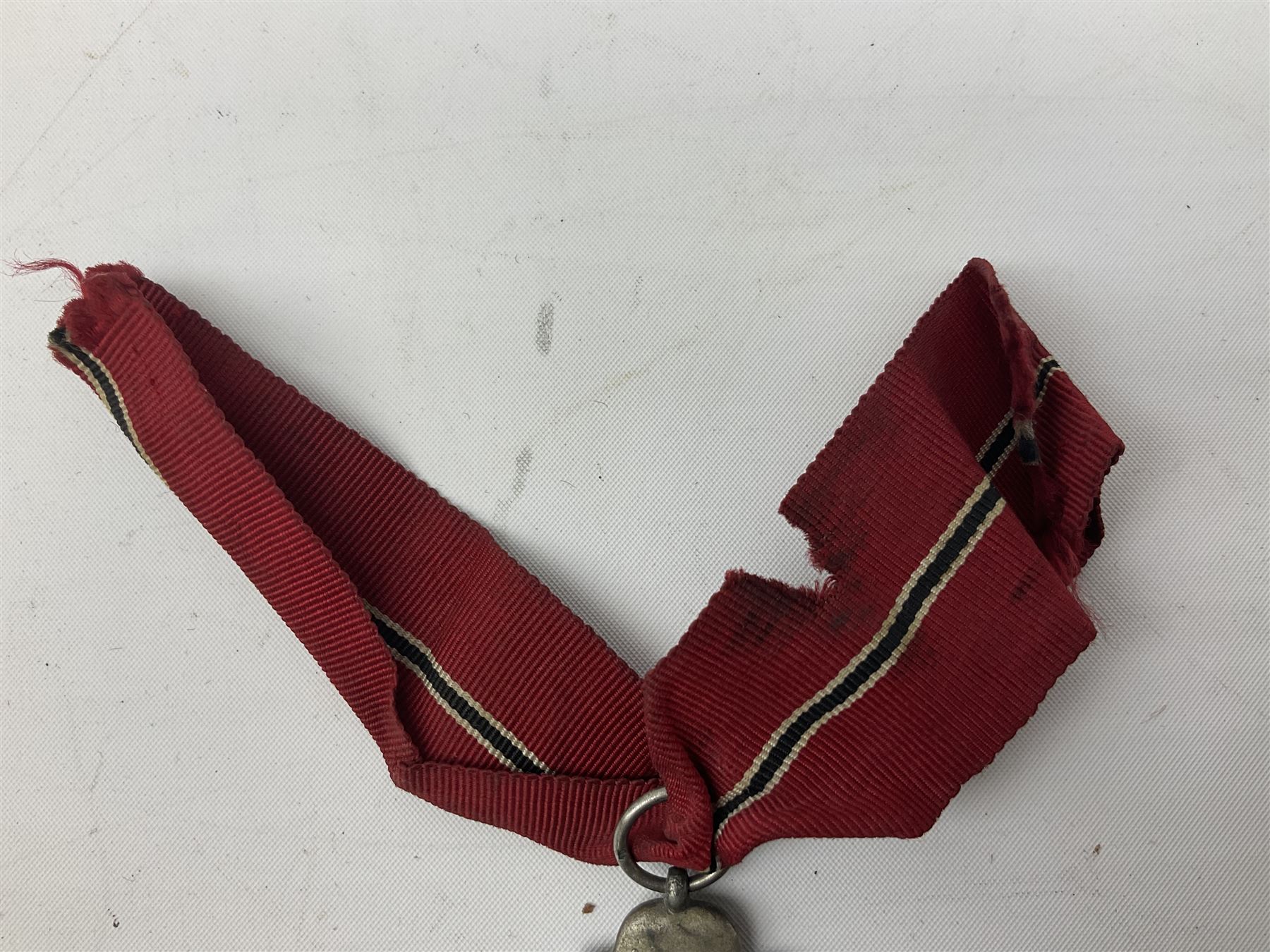 WW2 German Eastern Front Medal awarded to those who served on the German Eastern/Russian Front during the Winter Campaign period of 15th November 1941 to 15th April 1942 with original ribbon; and German War Merit Cross with swords 2nd Class (2)