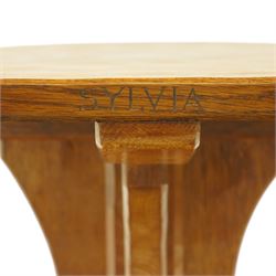 Mouseman - 1950s oak coffee table, octagonal adzed top on cruciform base and sledge feet, carved with mouse signature, dated 1956 and engraved 'Sylvia' to the top edge, by Ken Almack of the workshop of Robert Thompson, Kilburn

Notes:
Made by Ken Almack at the Robert Thompson workshop, Kilburn, where he trained and worked as a Mouseman craftsman; brother of Colin ‘Beaverman’ Almack, who later established his own workshop. The table was made for Sylvia to mark their engagement in 1956, prior to their marriage in 1957.

Provenance: The estate of Ken Almack; Tennants Auctioneers, 20th Century Design, 5 October 2024.