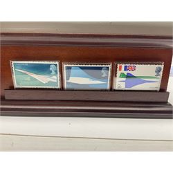 Danbury Mint 'The Ultimate James Bond Collection' comprising stamps and coins housed in a display case, 'Concorde Queen of the Skies' sculpture, stamps, medallion display and 2020 'Centenary of the Unknown Warrior' five pound coin cover in Harrington and Byrne folder