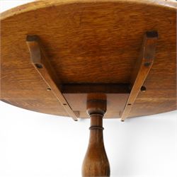 Traditional design golden oak tilt-top tripod table, brass fittings, turned baluster column on splayed supports