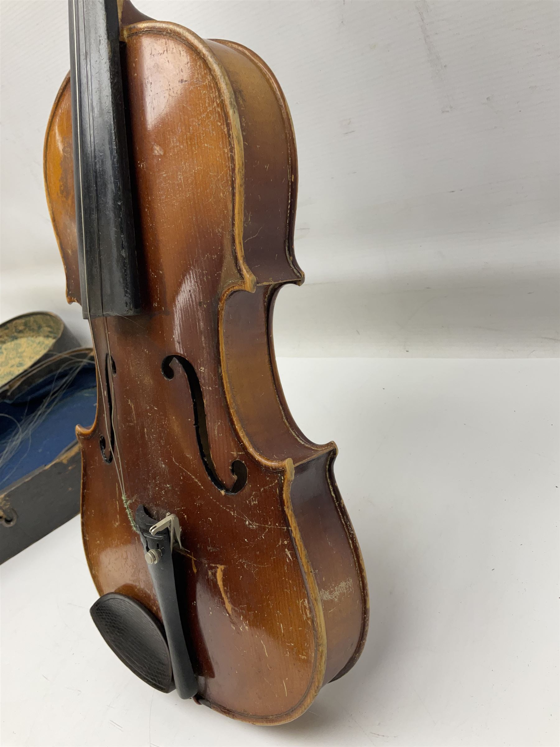 Czechoslovakian violin c1920 with 36cm two-piece maple back and ribs and spruce top, bears label 'Copy of Antonius Stradivarius Made in Czechoslovakia' L59cm; in carrying case; 1950s Czechoslovakian violin; and 195os Czechoslovakian three-quarter size violin; both cased (3)