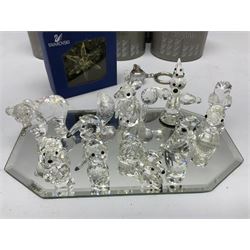 Collection of Swarovski Crsytal figures, to include Grizzly Bear Cub no.261925, Anteater, Kangaroo, Pig, other Swarovski keyrings etc and mirrored display stand
