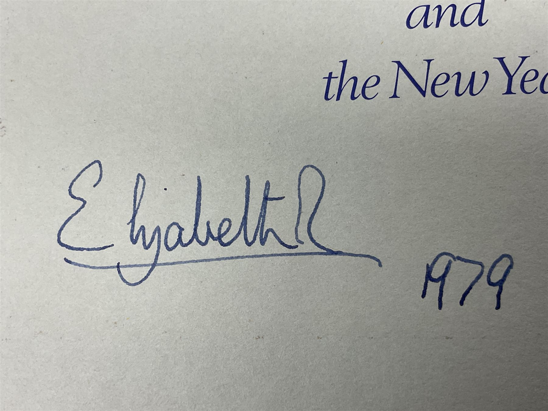 H.M. Queen Elizabeth II and HRH The Duke of Edinburgh, signed 1979 Christmas card with twin gilt ciphers to cover, colour photographic print of the Royal family standing in a garden, signed ‘Elizabeth R and Philip’ with manuscript date 1979 below