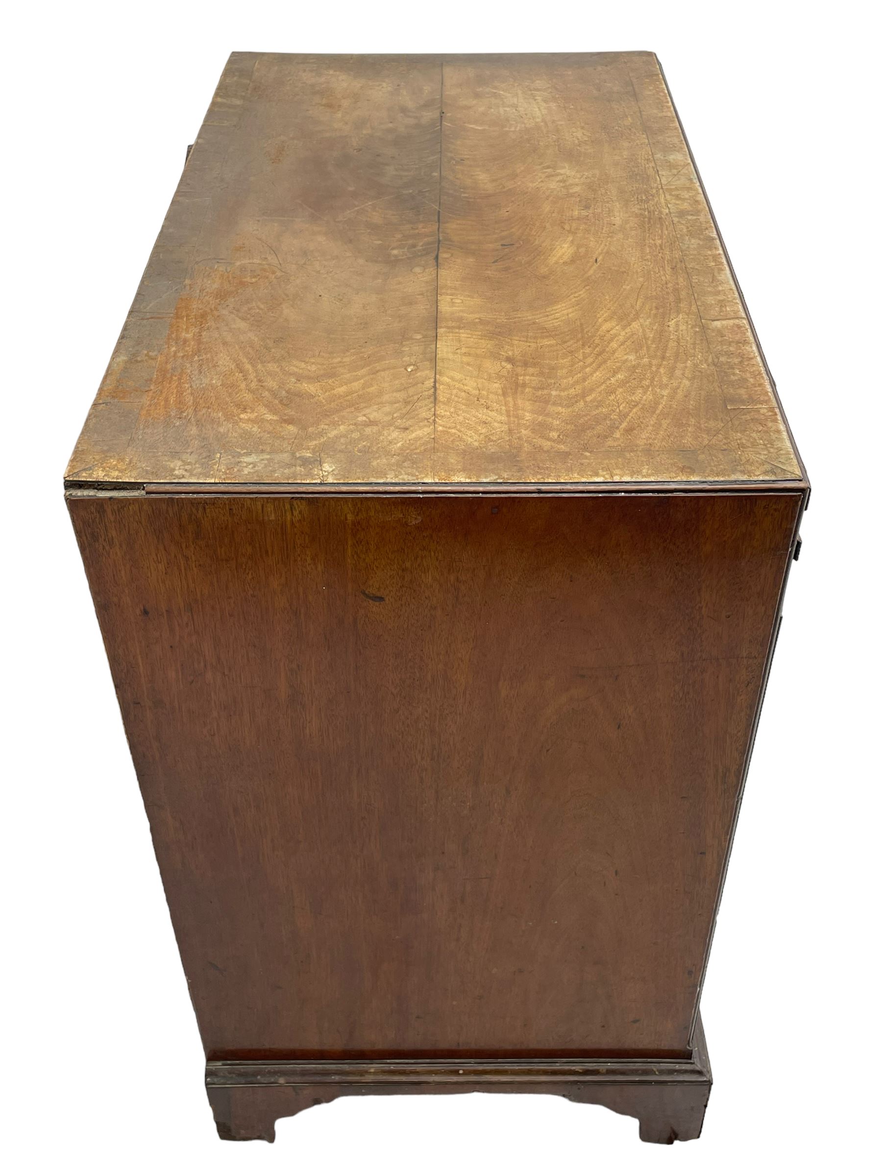 George III mahogany chest, banded caddy top with moulded edge, brushing slide over four graduating cock-beaded drawers, ornate cast gilt metal handle plates and escutcheons, swan neck handles cast with dolphins, shells and C-scrolls, lower moulding over bracket feet