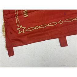 1970s Soviet banner printed in gold on a red ground, roughly translates as 'Transferable Banner - To the winner in the Socialist Competition' and 'Work Study Live by Communism' verso; wreath of wheat ears to either side; tassels on three sides 110 x 155cm