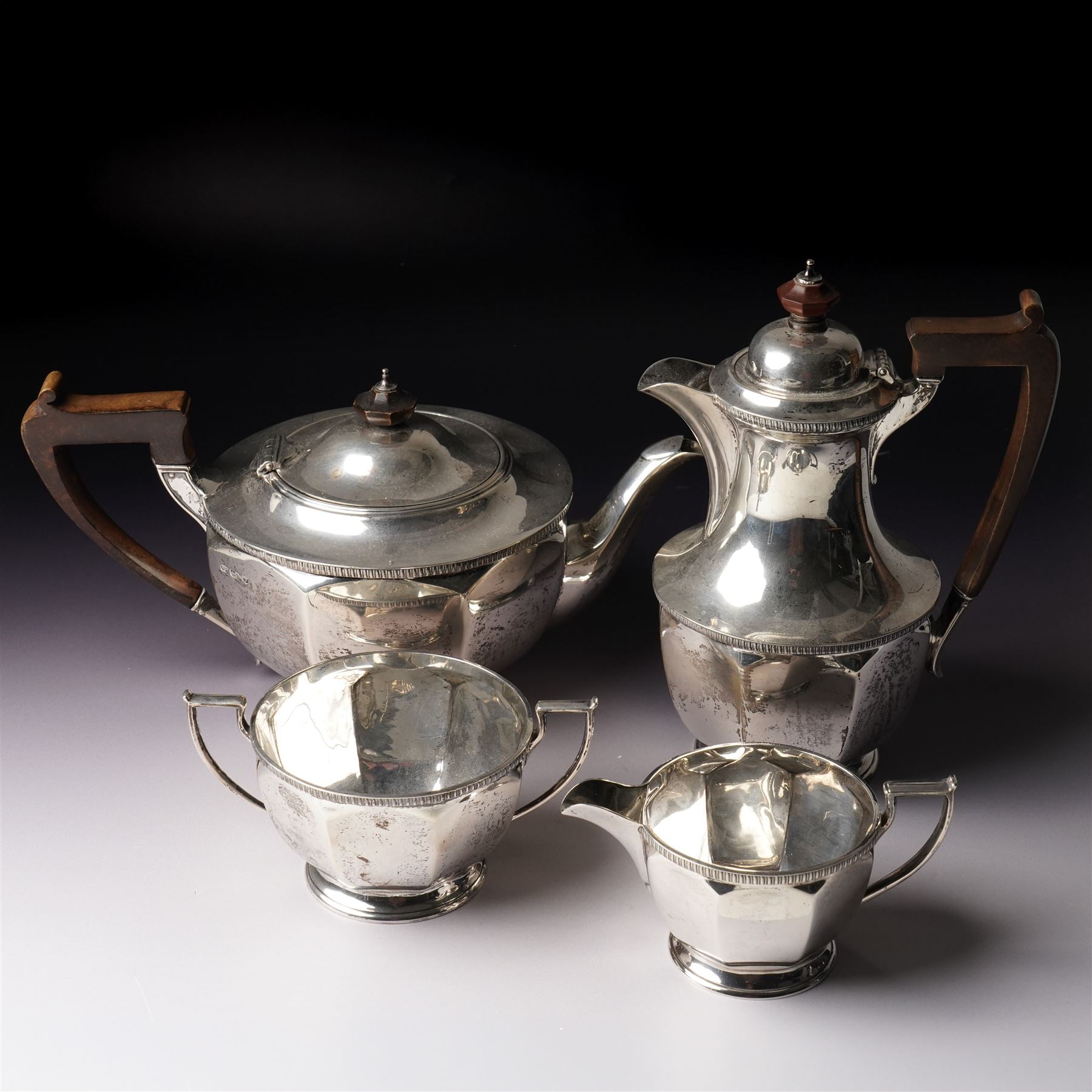  Silver tea set comprising teapot, hot water jug, sugar bowl and milk jug of circular panel sided design Sheffield 1941 Maker Harrison Brothers & Howson 