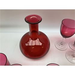 Victorian and later cranberry glass, comprising eight wine glasses, thirty two tumblers and a decanter
