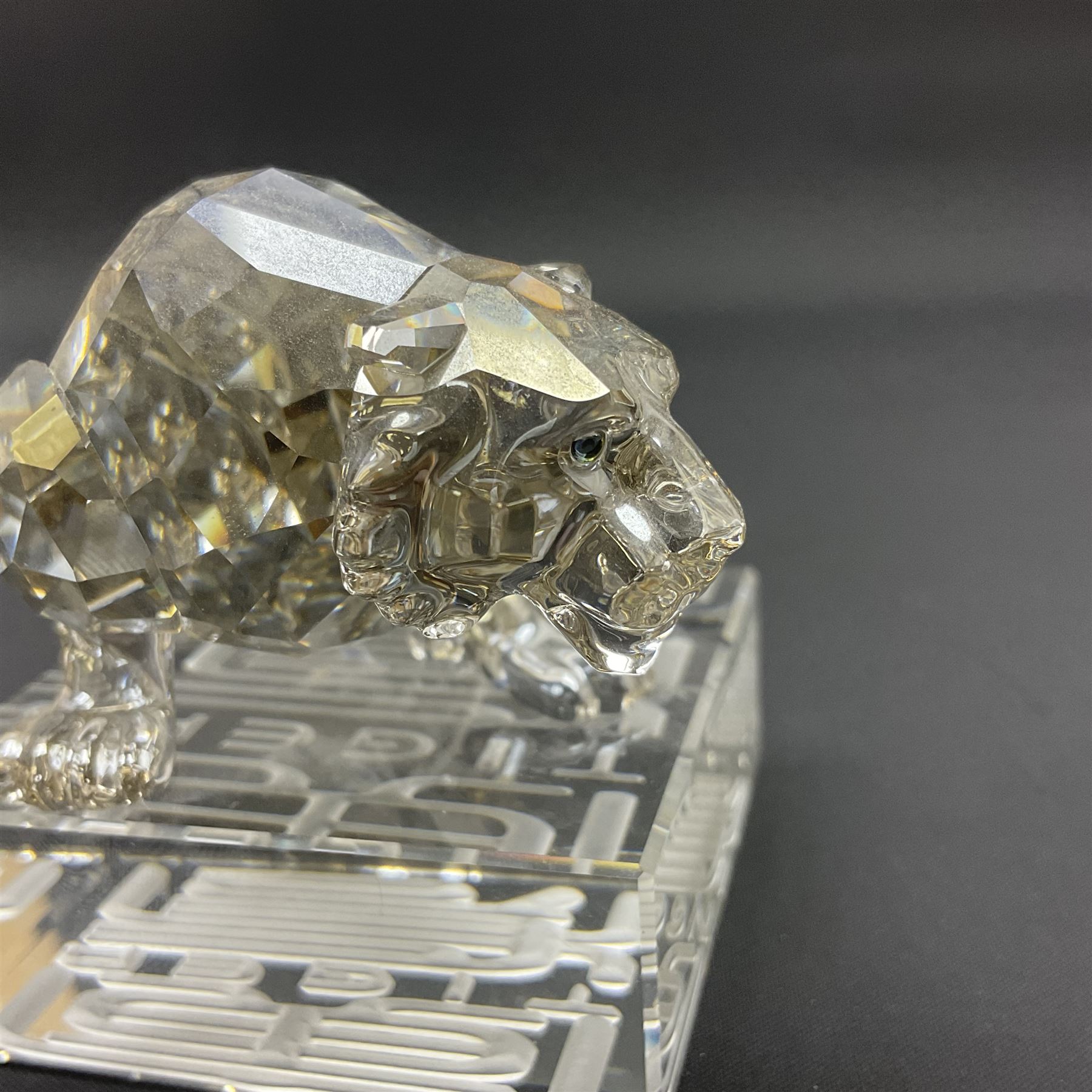 Two Swarovski Crystal Signs of the Zodiac figures, comprising horse and tiger, together with Zodiac dragon holding the flaming pearl, largest H11cm 