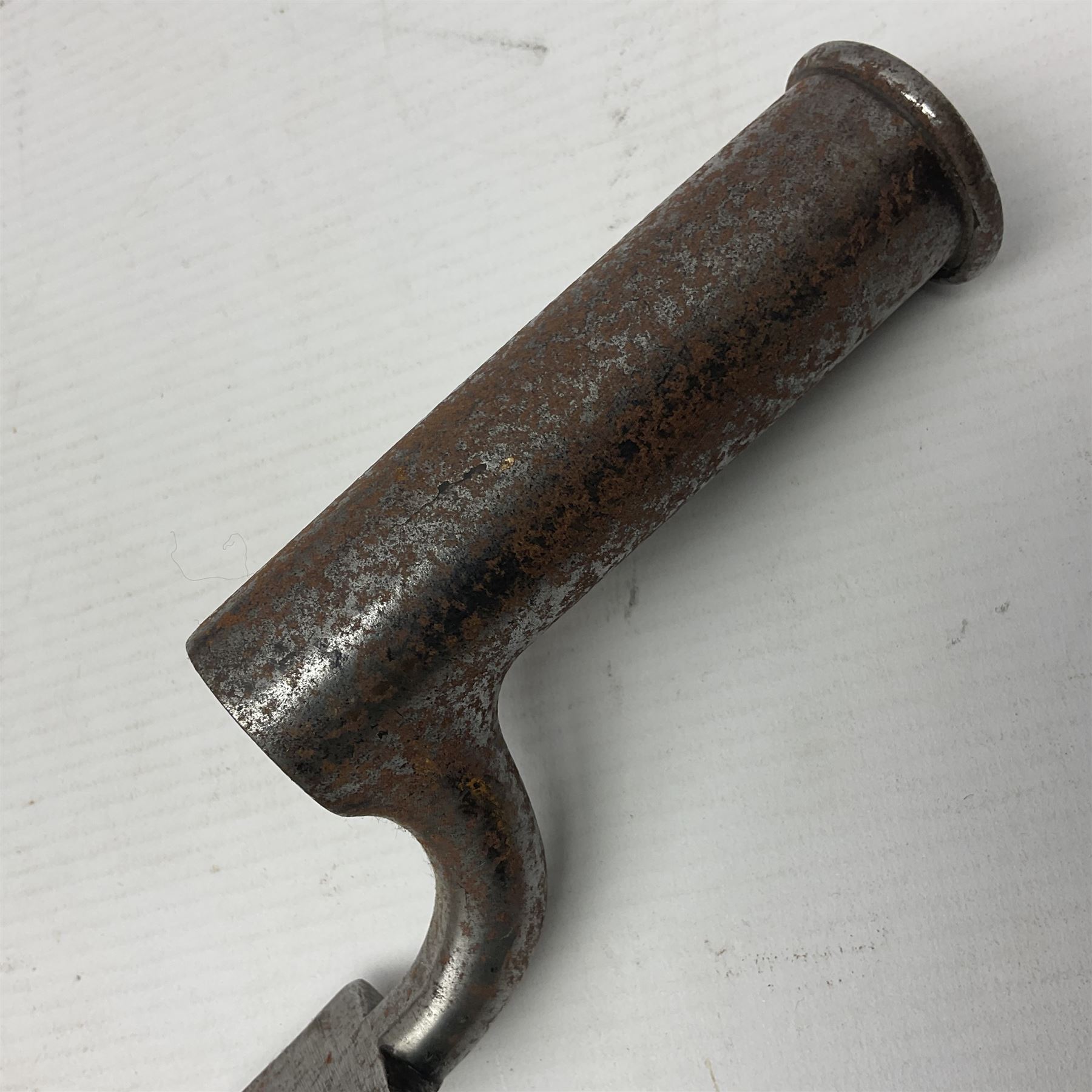 Brown Bess type socket bayonet the 40.5cm fullered triangular blade stamped WK, L52.5cm overall; malacca cane swagger type stick with white metal mounts and horse hair fly whisk; and another plain ebonised swagger stick (3)