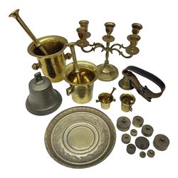 Four brass pestle and mortars, to include two miniature examples, together with other brassware including four branch candleabra, bells etc