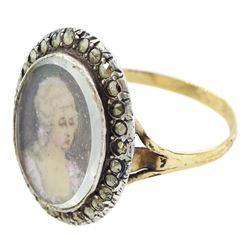 19th century French 18ct gold and silver marcasite portrait ring, set with an oval miniature of a woman on ivory, under glazed panel, with marcasite surround and trifurcated shoulders, hallmarked. This lot has been registered for sale under Section 10 of the APHA Ivory Act