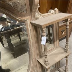 Late 19th century pine and gesso mirror back or wall mirror, pierced broken swan neck pediment decorated with foliate and central flower head motif, shield shaped bevelled mirror, the spandrels decorated with scrolled foliate decoration, two tier shelves on turned and fluted supports  - THIS LOT IS TO BE COLLECTED BY APPOINTMENT FROM THE OLD BUFFER DEPOT, MELBOURNE PLACE, SOWERBY, THIRSK, YO7 1QY