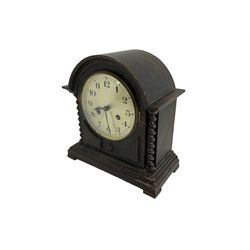 Striking mantle clock in an oak case