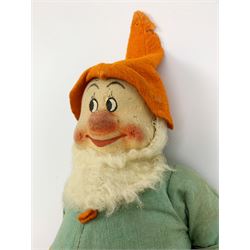 Chad Valley pressed felt figure of the Disney Snow White dwarf 'Doc' with painted facial features, standing wearing a green linen suit with orange hat, belt, buttons and shoes H13