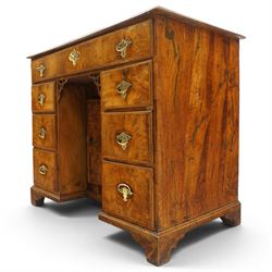 George III figured walnut kneehole desk, the rectangular top with feather and cross-banding with moulded edge, fitted with single frieze drawer over pierced spandrels and recessed cupboard, flanked by six graduating drawers, raised on bracket feet
Provenance: Kirkham Hall