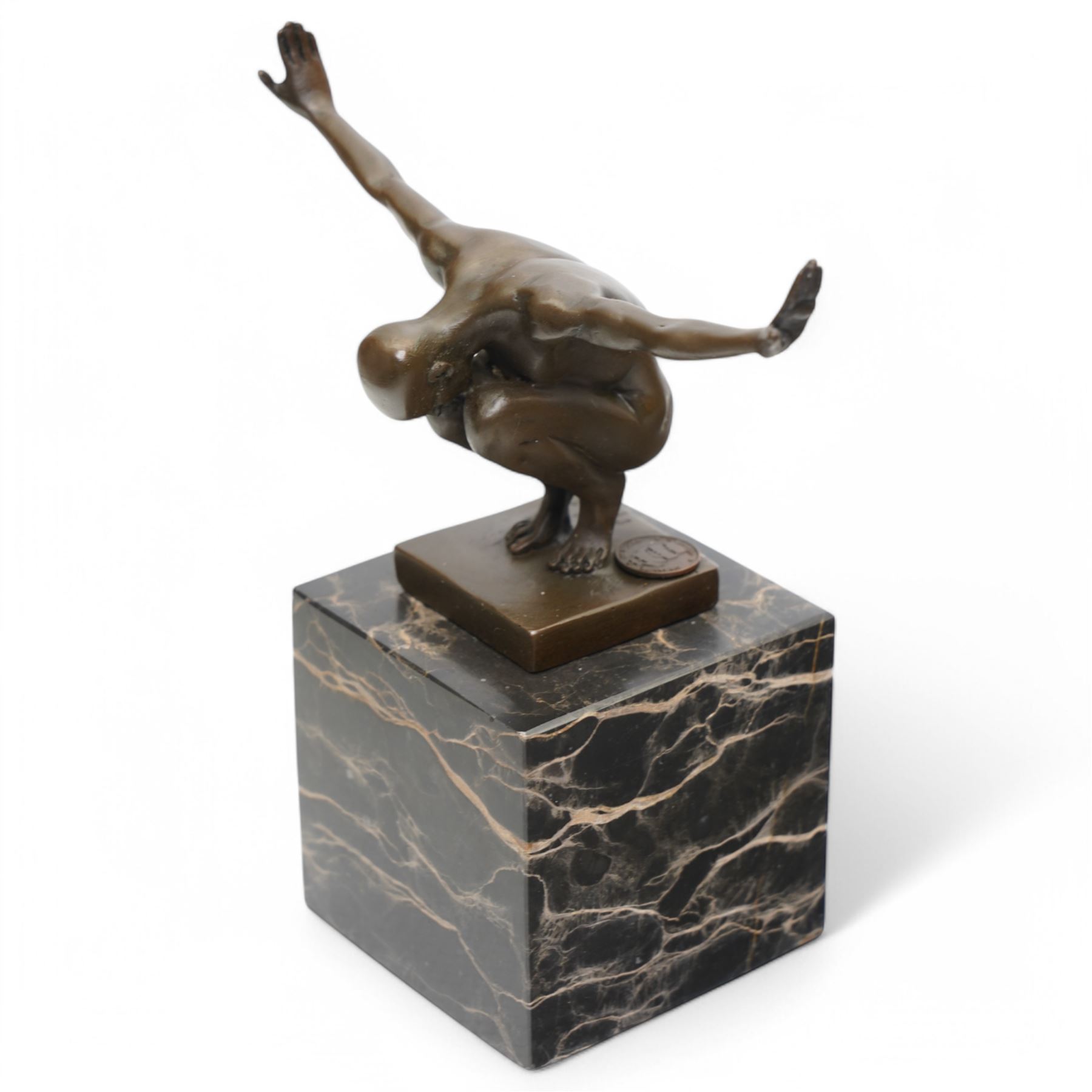 Bronze figure after Milo, a 'Power Of Silence', modelled as a male athlete crouched with arms outstretched upon a marble plinth, signed Milo, H15cm
