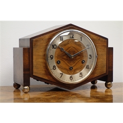  Art Deco walnut and oak mantel clock, angular case with silvered Arabic dial, three train movement chiming the quarter hours on rods, on brass ball feet, H21cm   