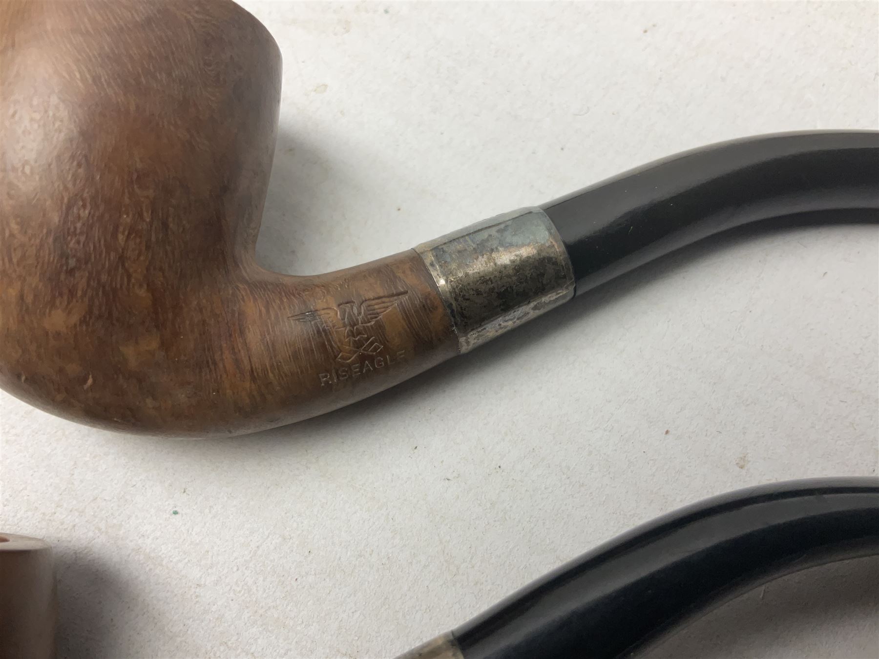 Collection of eight silver mounted pipes, comprising a briar wood Imperial ITC example with silver collar hallmarked A.W Birmingham 1903, horn handled example with silver collar hallmarked LB, probably Louis Blumfeld, Birmingham 1900, three examples marked B.W, one marked Globe A.O.C, Blumfeld's Best Briar pipe marked BBB and Riseagle example, together with two further pipes (10)