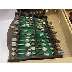 Six wooden spoon racks, containing a large quantity of silver plated souvenir and other collectors spoons