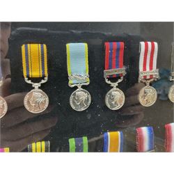 Limited edition large framed display board with sixty half-size copies of British Gallantry and Campaign Medals produced by Danbury Mint; all with ribbons and associated booklet