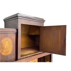 Early to mid-19th century figured mahogany Continental secrétaire à abattant, stepped top fitted with single cupboard, inlaid with oval figured amboyna panels, the fall front inlaid with shell motif enclosing a satinwood interior fitted with cupboard, drawers, and pigeon holes, three long drawers below, on square tapering feet