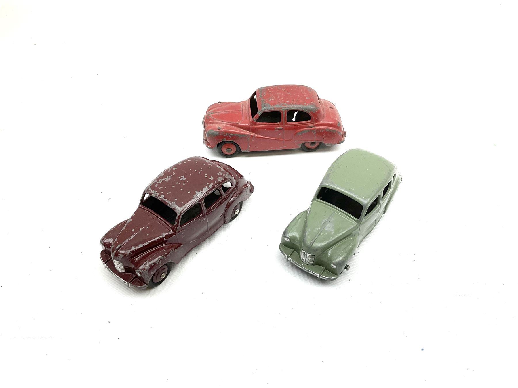 Dinky - seven unboxed and playworn die-cast cars comprising Studebaker, Ford Sedan, Rover 75, Vanguard, Austin Somerset and two Austin Devons; together with two Dublo size scale cars (9)
