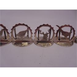 Set of six modern silver place card holders, each of circular form with pierced depictions of a partridge, spaniel, pheasant, stag, woodcock and duck, hallmarked J A Campbell, London 1985, contained within a velvet and silk lined fitted case, H3cm