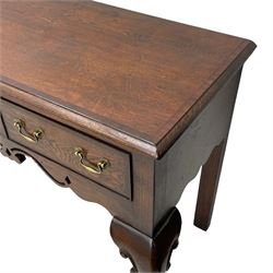 Georgian design oak and mahogany dresser base, the rectangular moulded top with mahogany band, three cocked-beaded and banded drawers over shaped a pierced apron, circular brass handle plates and swan neck handles, on C-scroll carved cabriole supports 