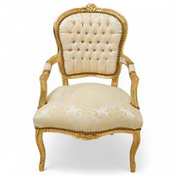 French design gold painted framed armchair, serpentine front with cream damask upholstery, padded arms with studded border  